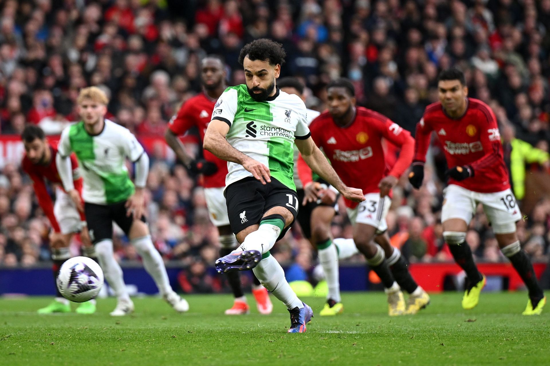 Salah scores Liverpool's second goal from the penalty spot.