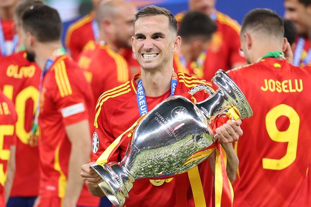 BERLIN, GERMANY - JULY 14: Fabian Ruiz of Spain celebrates with the UEFA Euro 2024 Henri Delaunay Trophy after his team's victory in the UEFA EURO 2024 final match between Spain and England at Olympiastadion on July 14, 2024 in Berlin, Germany.