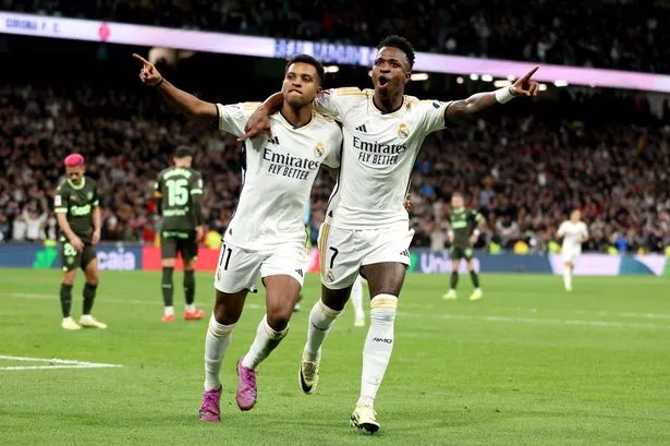 Rodrygo of Real Madrid celebrates scoring his team's fourth goal with teammate Vinicius Junior during the LaLiga EA Sports match between Real Madrid CF and Girona FC at Estadio Santiago Bernabeu on February 10, 2024